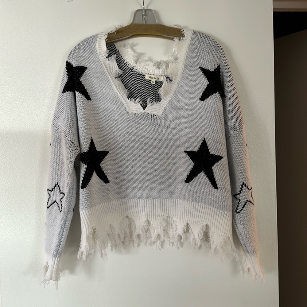 Adorable distressed star sweater
